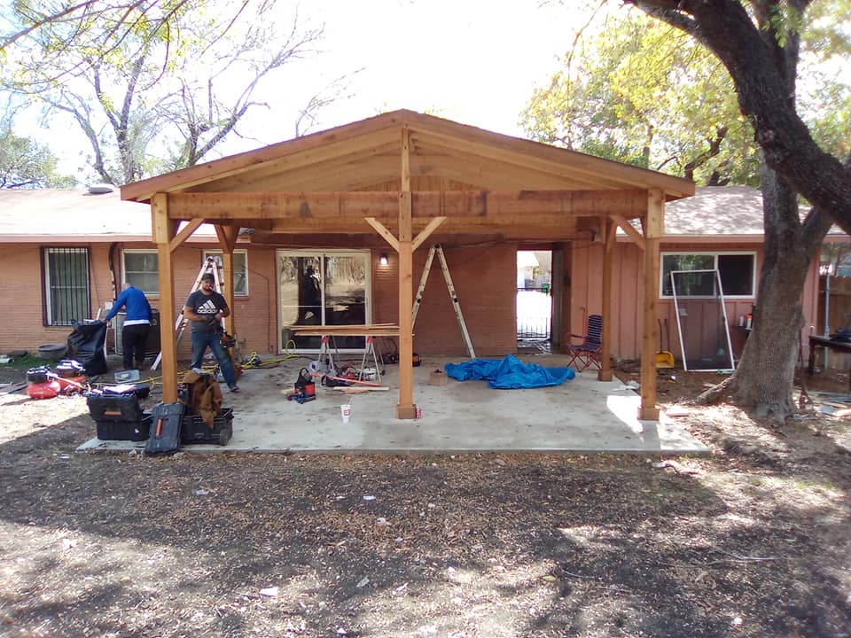 Completed backyard carpentry project showing deck and pergola combo
