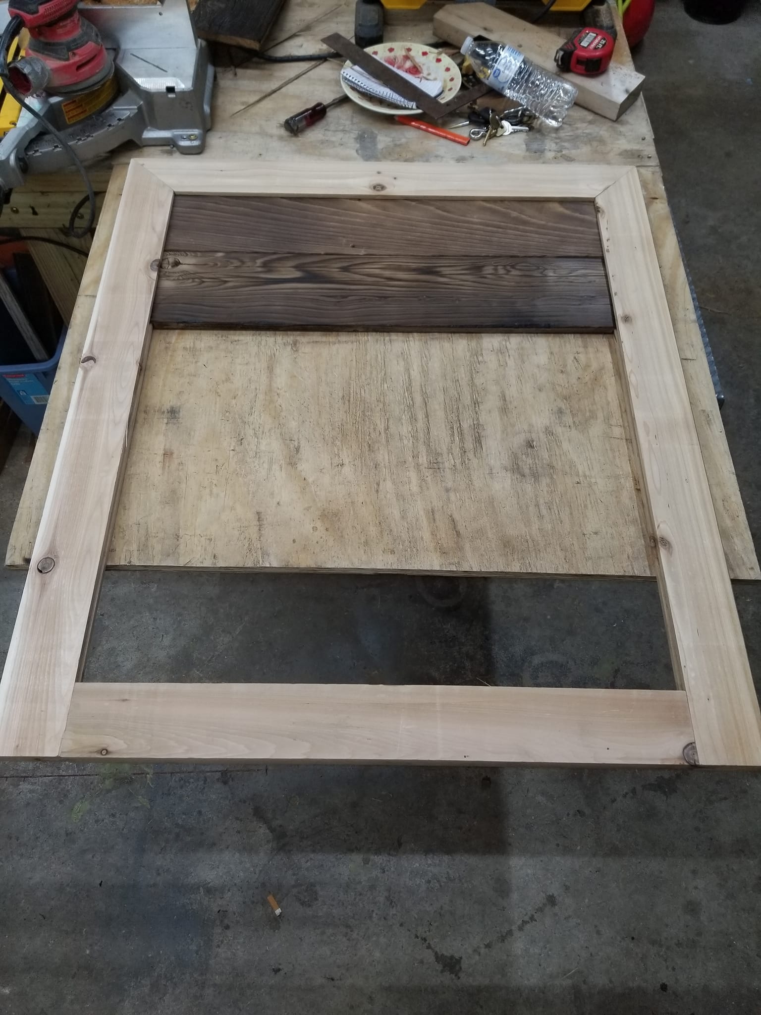 Wood arbor with climbing plant support beams installed by craftsmen