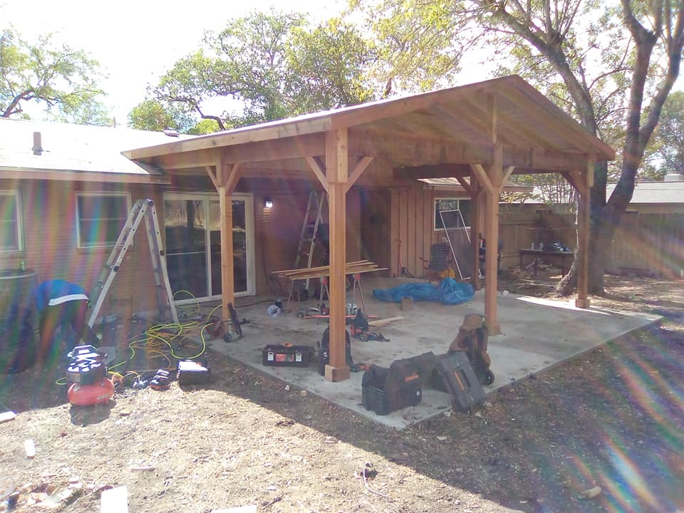 Outdoor wooden structure with decorative trim carpentry details