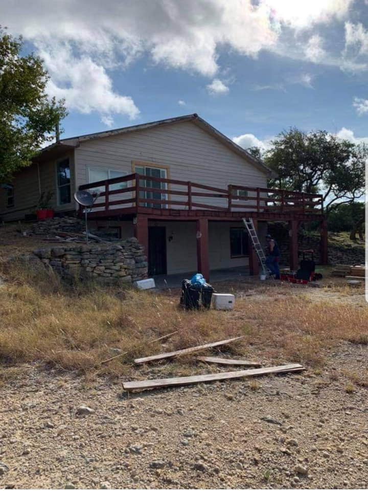 Freestanding pergola with cross-beam roof in residential backyard