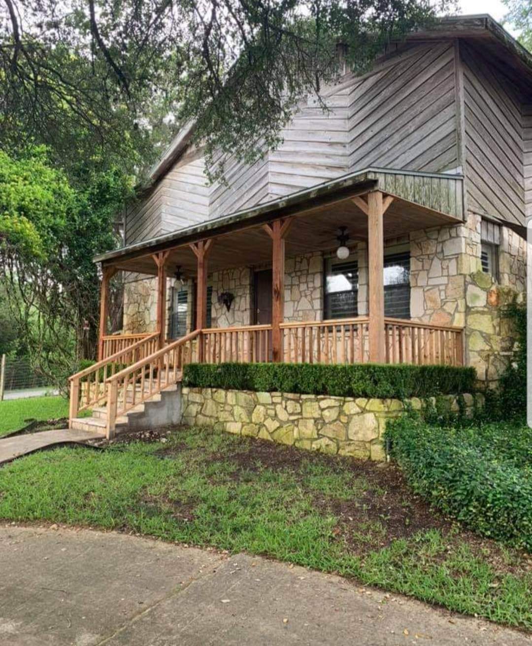 Attached pergola structure over backyard patio by Against the Grain Woodworks