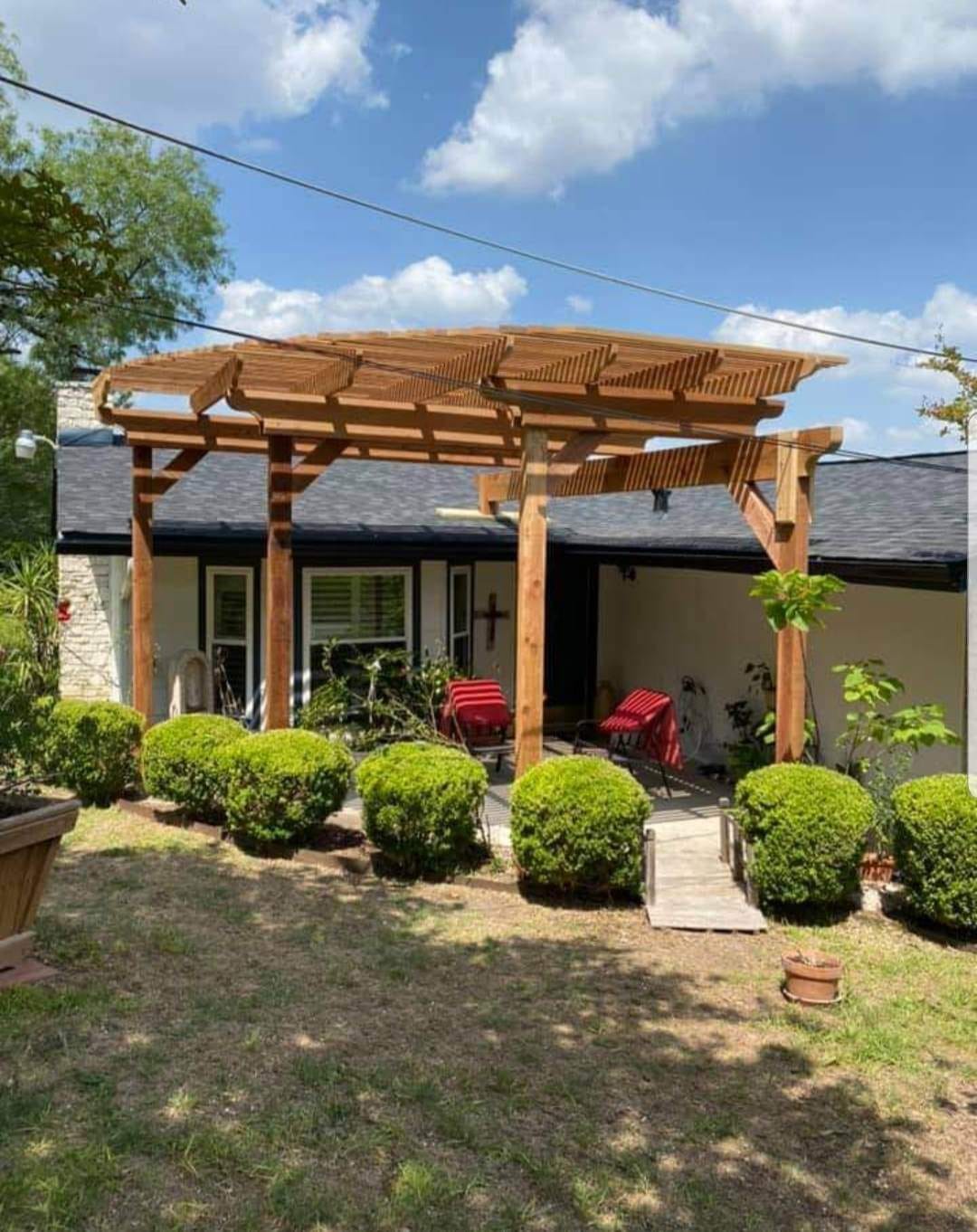 Raised deck with railing system built by Against the Grain Woodworks